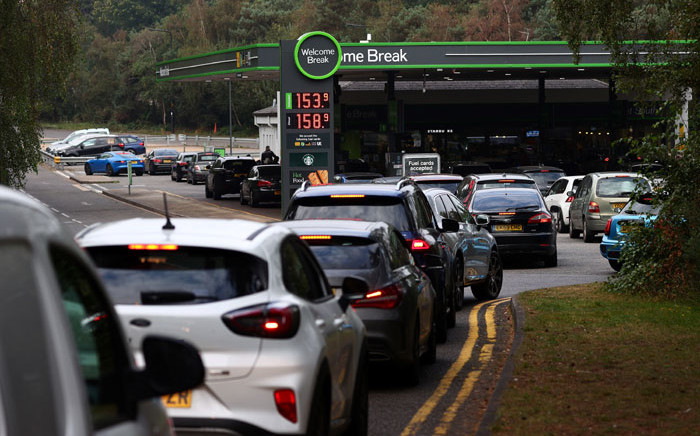 Motorists queue for petrol and diesel fuel at a petrol station off of the M3 motorway near Fleet, west of London on 26 September 2021. Picture: Adrian Dennis/AFP