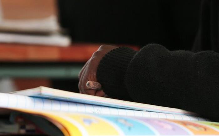 FILE: A Samson Senior Primary School pupil clutches a pencil while listening to his teacher. Picture: Reinart Toerien/EWN