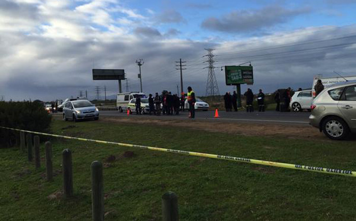 FILE: Police and forensic experts at the scene where a police officer was stabbed to death in an attack on the N2 highway. Picture: Natalie Malgas/EWN