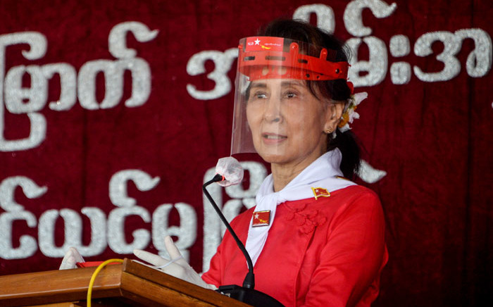 FILE: Myanmar's political leader Aung San Suu Kyi wears a face shield as she attends a ceremony to mark the 32nd anniversary of the National League for Democracy (NLD) in Naypyidaw on 27 September 2020. picture: Thet Aung/AFP