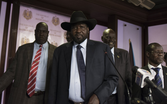 South Sudan President Salva Kiir (C), followed by Vice President James Wani Igga (2nd R), leaves the conference room as artillery fire broke out near the presidential palace in Juba on 8 July, 2016. Picture: AFP.