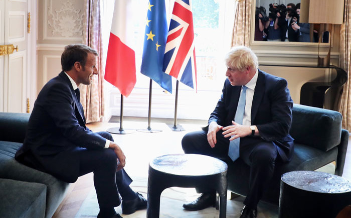 French President Emmanuel Macron (L) and Britain's Prime Minister Boris Johnson (R) speak during a meeting at the Elysee Palace in Paris on 22 August 2019. Picture: AFP