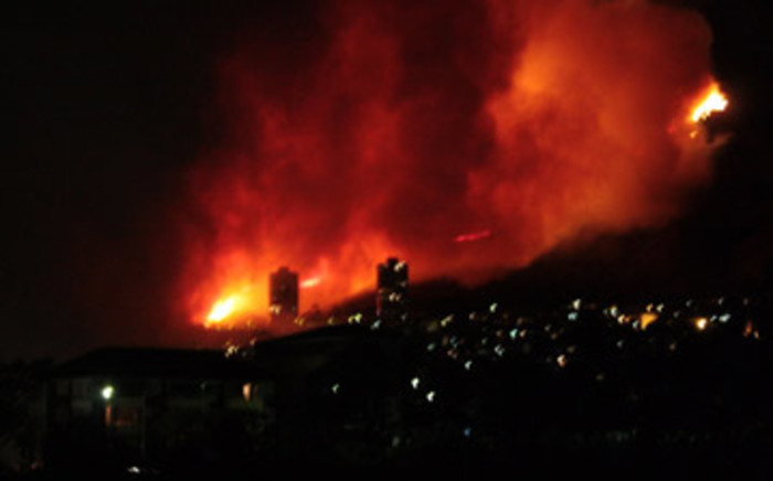 Cape Town fires rage in the distance on 18 March 2009. Photo: Joe Vaz/iWitness