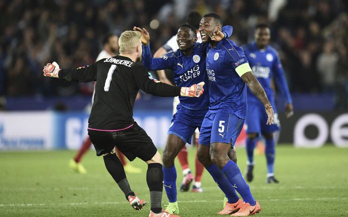 Leicester City's Wilfred Ndidi (C), Wes Morgan (R) and Kasper Schmeichel (L) celebrate a victory. Picture: AFP