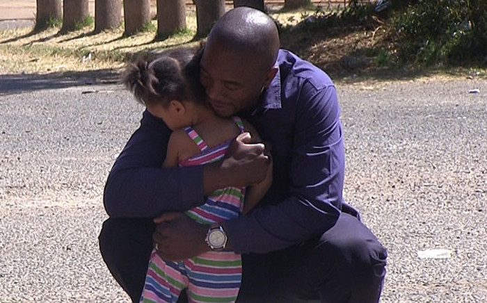 DA parliamentary leader Mmusi Maimane hugs a child in Eldorado park south of Johannesburg on 8 September 2014. Picture: Reinart Toerien/EWN