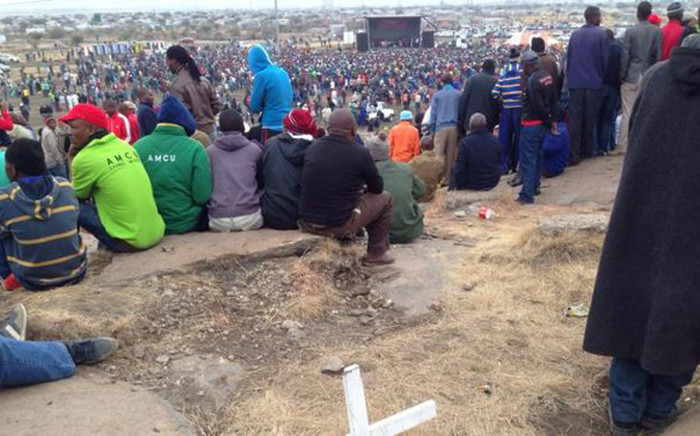 Miners listen to proceedings whilst sitting on the Koppie on the two year anniversary of the Marikana massacre. Picture: Vumani Mkhize/EWN.