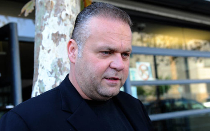 Czech businessman Radovan Krejcir speaks to reporters outside the Johannesburg Magistrate's Court on 16 April 2012, after fraud charges against him were provisionally withdrawn. Picture: Sapa