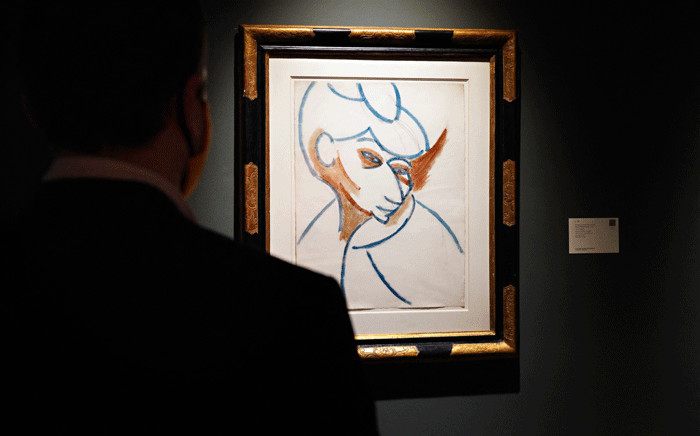 A person looks at "Tête de femme" by Pablo Picasso during a press preview of the upcoming Impressionist and Modern Art Evening Sale at Sotheby's on October 23, 2020 in New York City. Picture: Cindy Ord/Getty Images/AFP