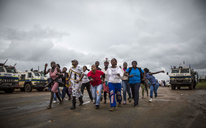 Protesters in Vuwani sing and dance under police supervision. Picture: Thomas Holder/EWN