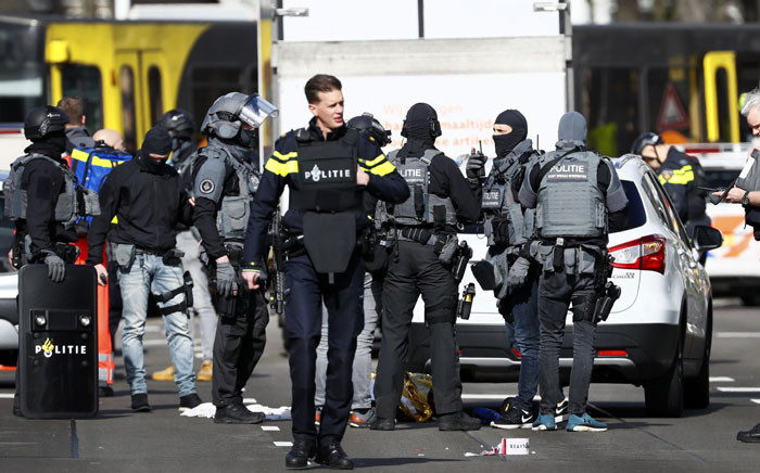 Police forces stand near a tram at the 24 Oktoberplace in Utrecht, on 18 March 2019 where a shooting took place. Picture: AFP