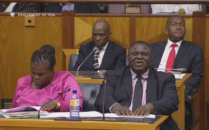 A screengrab of Communications Minister Faith Muthambi (left) and Hlaudi Motsoeneng (back left) in a parliamentary committee meeting.