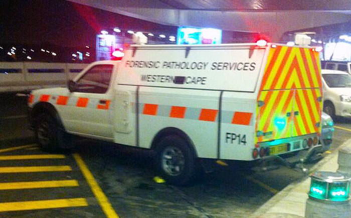 A forensic pathology vehicle stands outside the Cape Town International Airport 28 May 2014 after a police officer shot his girlfriend and then himself at a popular restaurant. Picture: Chanel September/EWN
