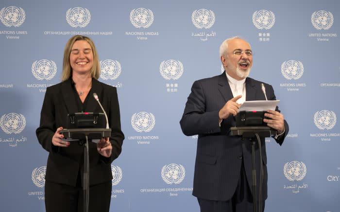 Iranian Foreign Minister Mohammad Javad Zarif (R) and EU foreign policy chief Federica Mogherini hold a press conference at the E3/EU+3 and Iran talks at the International Atomic Energy Agency headquarters in Vienna on 16 January 2016. Picture: AFP. 