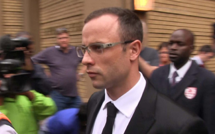 Oscar Pistorius leaves the High Court in Pretoria after his murder trial was postponed on 28 March 2014. Picture: Picture: Christa van der Walt/EWN.