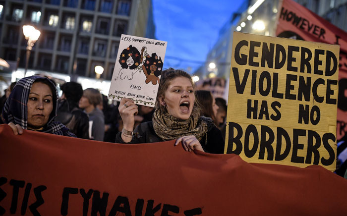 Women holding signs and banners take part in a march staged by feminist, anti-racist and human rights organizations to mark the International Women's Day in Athens on 8 March 2019. Picture: AFP