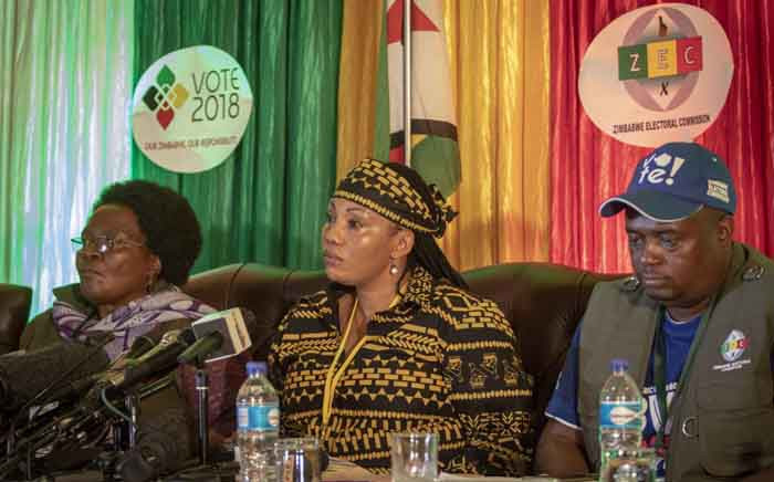 The Zimbabwean Electoral Commission, led by chairperson Priscilla Chigumba (C), addressing the media on initial results and voter turnout. Picture: Thomas Holder/EWN