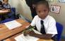 A grade 1 pupil gets settled in at the Forest Village Leadership Academy in Eerste River, Cape Town on 9 January 2019. Picture: Lauren Isaacs/EWN