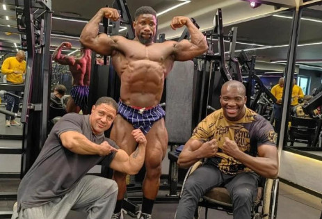 Wheelchair bodybuilder Macethandile "Max" Kulati, Coach Lionel Harker and bodybuilder Lloyd Gobelani flexing at the gym. Picture: Ibff Pro Max/ Facebook.