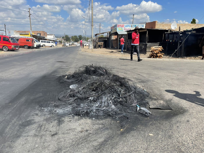Diepsloot residents barricaded roads with rubble and overturned bins during their protest against crime in the area on 6 April 2022. Picture: Masechaba Sefularo/Eyewitness News
