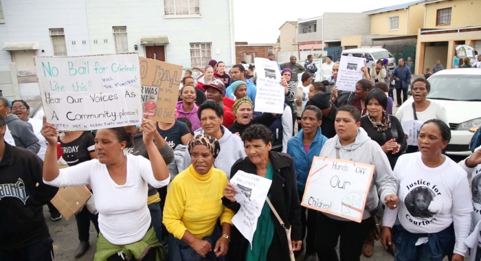 Community members protest outside the house of Courtney Pieters. Picture: Bertram Malgas