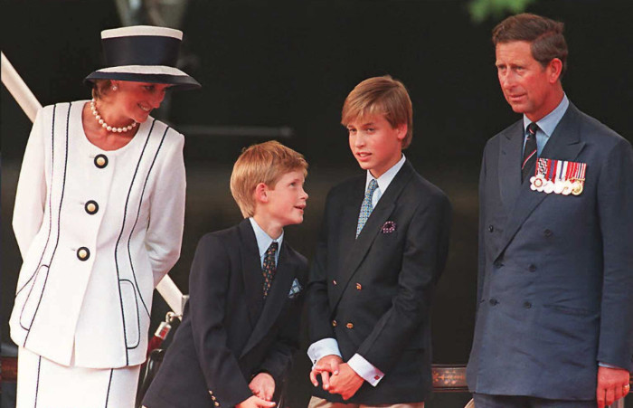 FILE: Princess Diana, her sons Harry and William, and Prince Charles watch the parade march past as part of the commemorations of VJ Day on 19 August 1995 in London. Picture: AFP
