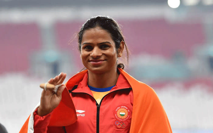 Silver medallist India's Dutee Chand celebrate during the victory ceremony for the women's 100m athletics event during the 2018 Asian Games in Jakarta on August 26, 2018. Picture: AFP.