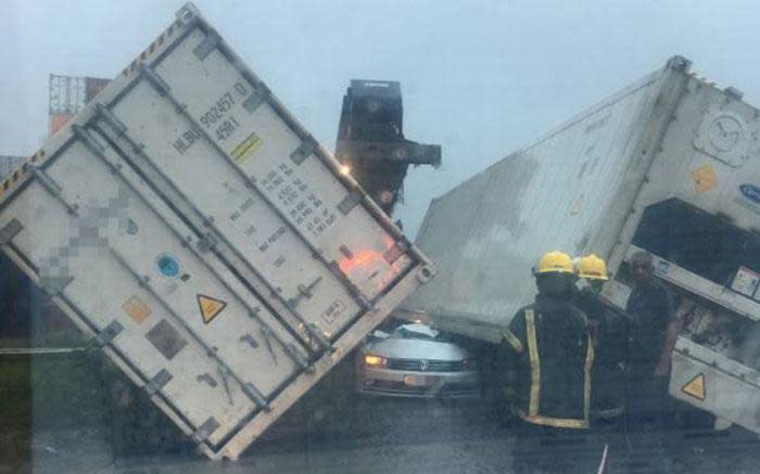 One person has been killed and another injured after shipping containers fell on a vehicle during the KZN storm. Picture: Arrive Alive.
