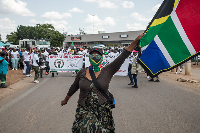 Operation Dudula members in Rosslyn, Pretoria, on Tuesday, 29 March 2022. Picture: Boikhutso Ntsoko/Eyewitness News