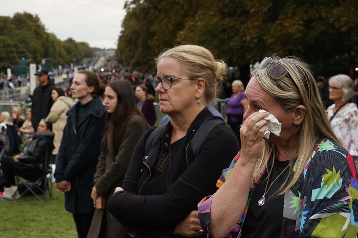 Members of the public line up on The Long Walk in Windsor on September 19, 2022, to see the coffin of the late Queen Elizabeth II making its final journey to Windsor Castle after the State Funeral Service of Britain's Queen Elizabeth II. Picture: Carlos Jasso / Pool / AFP