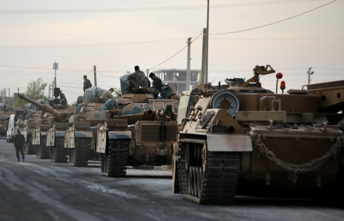 Tanks are pictured lined up as Turkish soldiers and Turkey-backed Syrian fighters deploy near the Turkish village of Akcakale along the border with Syria on 11 October 2019, as they prepare to take part in the Turkish-led assault on northeastern Syria. Picture: AFP