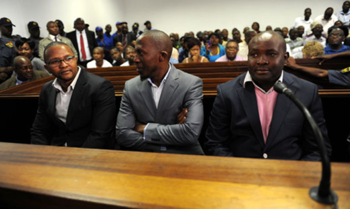 Business associates (from left) Kagisho Dichabe, Lesiba Gwangwa and Makgetsi Manthatha of axed ANC Youth League leader Julius Malema appear in the Polokwane Magistrate's Court on Tuesday, 25 September 2012. Picture: Werner Beukes/SAPA.