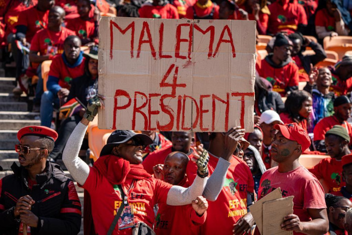 An EFF supporter holding a 'Malema for President' placard during the birthday celebration at the FNB Stadium. Picture: Rejoice Ndlovu