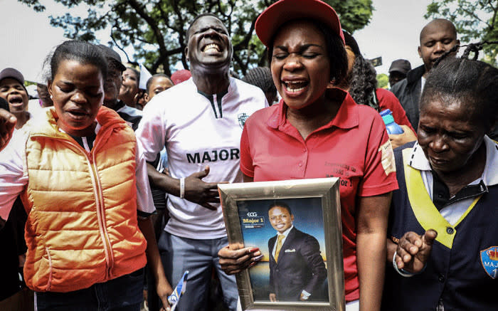 Supporters of Prophet Shepherd Bushiri protest outside the Specialised Commercial Crimes Court in Pretoria. Bushiri and his wife Mary appeared in court for charges of fraud, money laundering and contravening the Prevention of Organised Crimes Act. Picture: Abigail Javier/EWN. 
