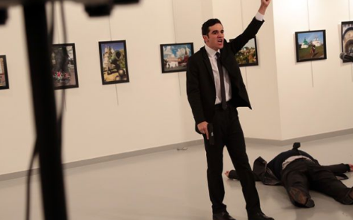 A screengrab of the gunman brandishing a gun after shooting the Russian ambassador to Turkey Andrei Karlov.