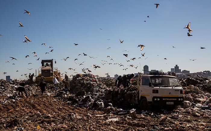 Waste pickers are seen in the Robinson Deep landfill site in Johannesburg.  The site has a maximum of 3 years left until it reaches capacity.  From the 1st of July Johannesburg residents are compelled to separate their garbage from recyclable material in an effort to avoid reaching this point.  Picture: Christa Eybers/EWN  