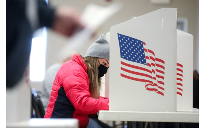 A voter marks her ballot on 3 November 2020 in Des Moines, Iowa.