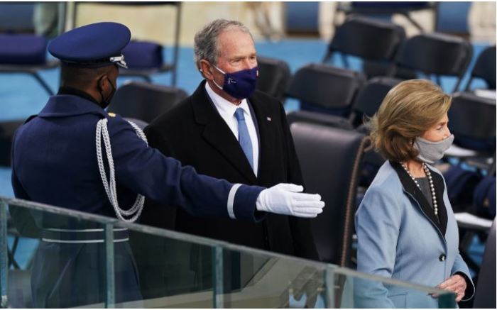 Former US President George W. Bush and former US First Lady Laura Bush arrive.