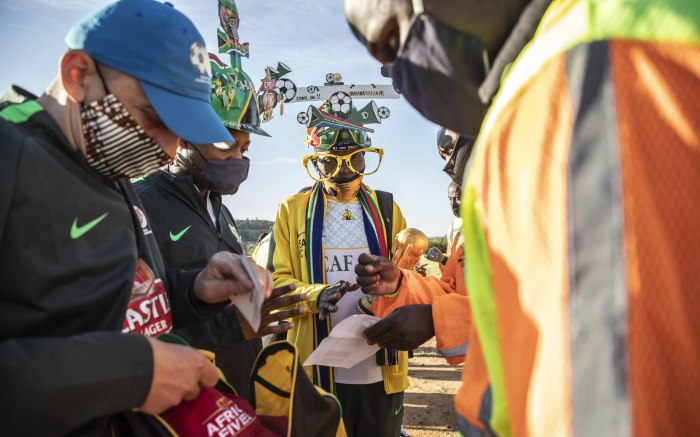 Fans having their vaccine card, ID document and ticket checked outside the FNB Stadium.  Picture: Abigail Javier/EWN