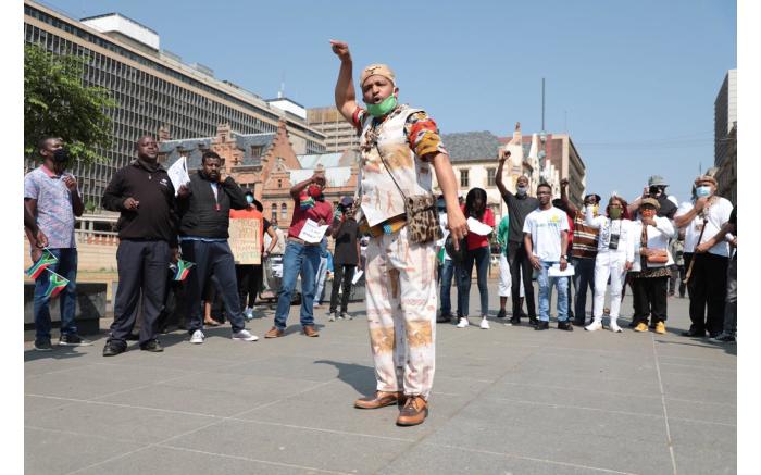 Stanley Peterson of Khoisan revolution speaking to the protesters ahead of the march.