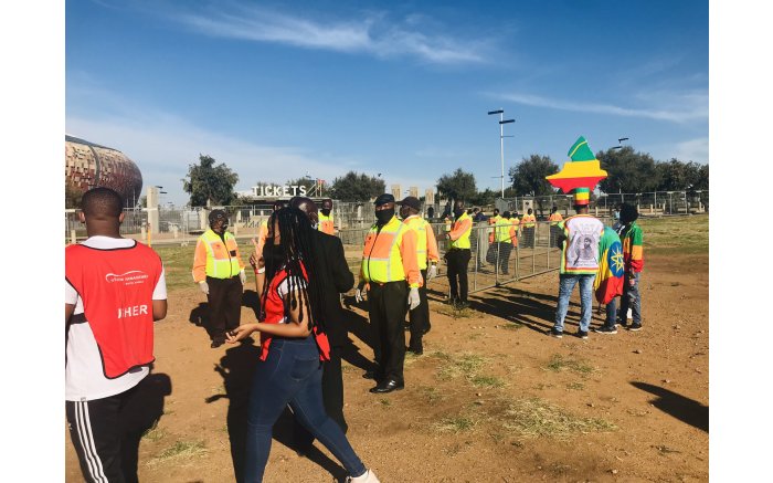 Excited fans outside the FNB Stadium for Bafana Bafana vs Ethiopia in a 2022 FIFA World Cup qualifier. Picture: Tholakele Mnganga/EWN