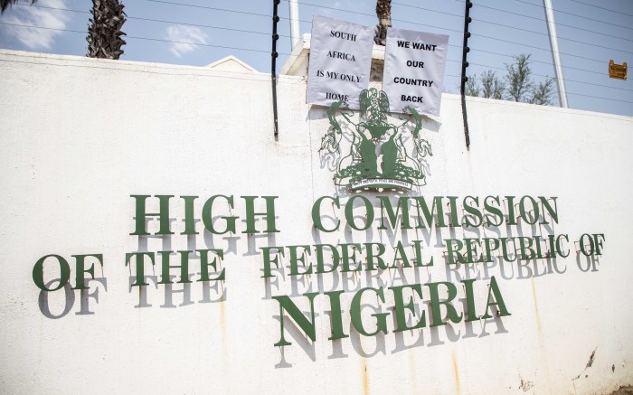 Protesters hung their placards on the wall of the Nigerian embassy. 