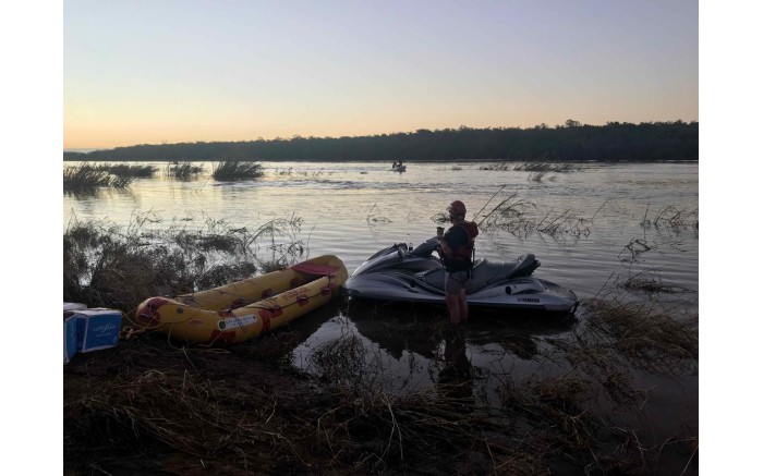 Relief workers return to Estaquina, west of Beira, after a day of aid distribution on the Buzi River.