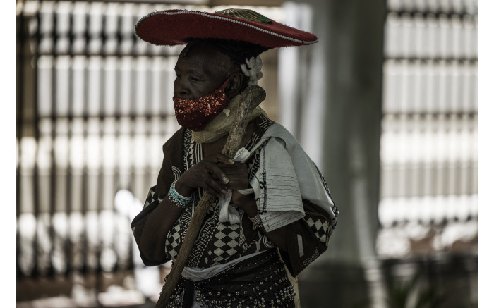 A mourner queues outside the St George's Cathedral in Cape Town to pay his respects.