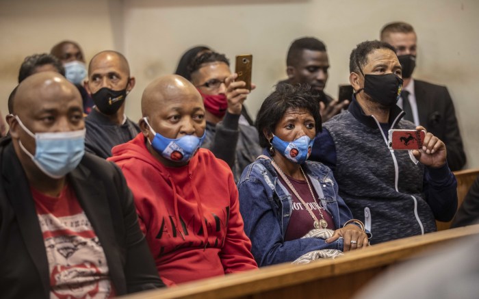 Family members support Nathaniel Julies' mother Bridget Harris (second from right) in court.