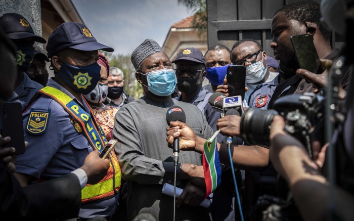 Civil society organisation leaders speak to Nigerian Ambassador Kabiru Bala and hand a memorandum over to him.