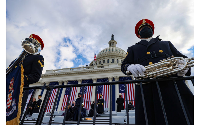 Members of the US Army Band Pershing's Own look on ahead of the inauguration.