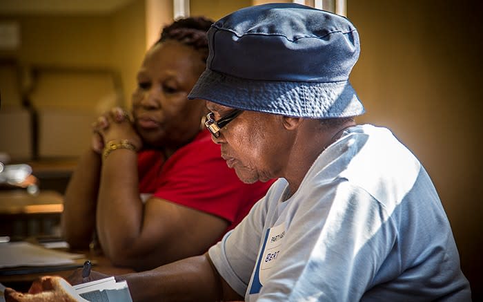 READY TO SERVE: An IEC volunteer waits to register voters at the Orlando West High School in Soweto. Picture: Reinart Toerien/EWN