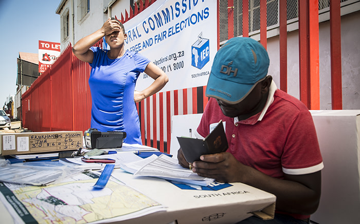 An IEC official takes down the details of a new eligible voter registering in Denver near Johannesburg's CBD. Picture: Reinart Toerien/EWN