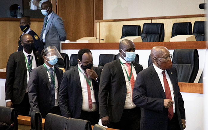 Former President Jacob Zuma (far right) arrives at the state capture commission of inquiry