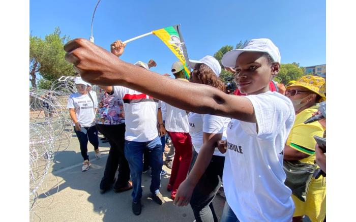 Supporters of ANC secretary-general Ace Magashule gather outside the Bloemfontein Magistrates Court on 13 November 2020.